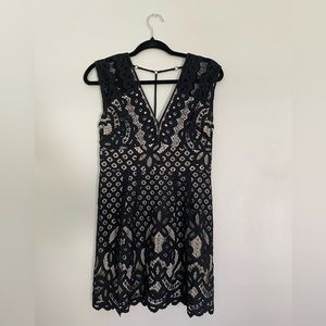 Free People black lace mini dress. Size 4